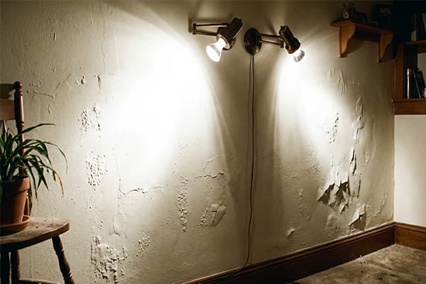 An image showing a bad lighting example, like hotspots or magnified flaws on a wall